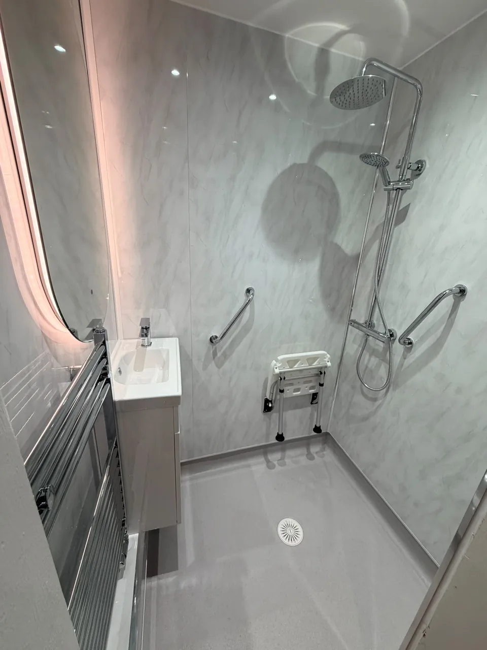 Shower tray, chrome controls and folding shower seat
